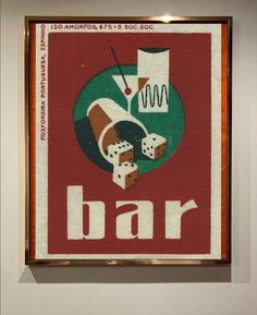 a sign that says bar with dices in the center and two pieces of food on it