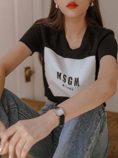 Short sleeve T-shirt with front color block panel and print detail, MSGM Milano. 100% cotton. Model is in MINUSEY ONE SIZE. ✔️ Free worldwide express shipping over $100✔️ Loved by 6,500+ customers✔️ Limited edition collections, maximum style⠀⠀⠀⠀⠀⠀⠀⠀⠀Stay ahead of the trend with can’t-find-anywhere-else staples. Your closet will thank you 💕 * MINUSEY ONE SIZE = EU 34-38, US 2-6* 100% Cotton* Dry clean* Made in Korea - Model Height: 170cm/5'7" (US2, EU34) Trendy Black Cotton T-shirt, Black Trendy T-shirt With Logo Print, Trendy Black T-shirt With Logo Print, Black Graphic Tee With Contrast Color, Sporty Black T-shirt With Contrast Color, Contrast Graphic Print Short Sleeve Top, Contrast Color Graphic Print Short Sleeve Top, Casual T-shirt With Contrasting Colors And Graphic Print, Casual Black Color Block Tops