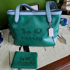 Brand New, Tags Attached, Coach Purse And Matching Wallet. Grass Green Body With Sky Blue Straps. Excellent Condition, Never Carried. Coach Green Wallet For Everyday Use, Green Coach Wallet For Everyday Use, Louis Vuitton Duffle Bag, Bucket Tote Bag, Coach Tote Bags, Women Purse, Carryall Tote, Suede Handbags, Coach Tote