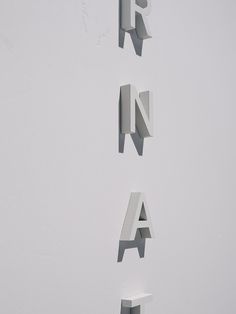 the letters are made up of different shapes and sizes, including one that is white