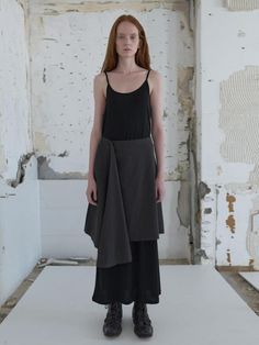 Knee-length, A-line skirt with asymmetric draping and uneven hem. Regular waist and raw cut hem.- Midi- Regular waist- A-line Voluminous Lined Asymmetrical Wrap Skirt, Voluminous Asymmetrical Wrap Skirt With Lining, Asymmetrical Hem Skirt For Workwear, Relaxed High-low Hem Skirt For Workwear, Relaxed Fit High-low Hem Skirt For Work, Asymmetrical Draped Skirt With Lining, Voluminous Asymmetrical Skirt For Workwear, Asymmetrical Draped Skirt For Work, Chic Asymmetrical Hem Gathered Skirt