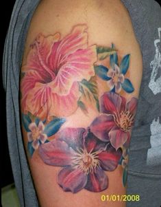 a woman's arm with flowers painted on it