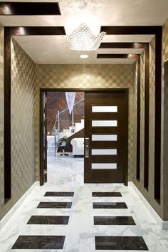 an instagramted photo of a hallway with black and white tiles