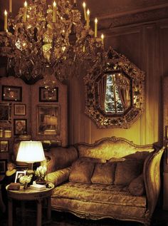 a living room filled with furniture and a chandelier