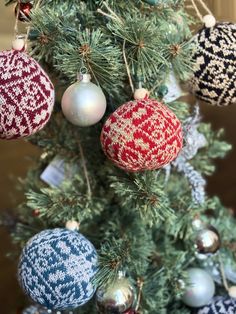 a christmas tree with ornaments hanging from it