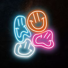 two neon signs that have faces and hands in the shape of hearts, with one holding a phone