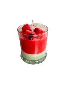 a small glass bowl filled with red and green dessert