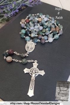 "Beautifully made chain link rosary, approximately 23\" long. Beads and stations are 8mm Natural Fancy Jasper Matte Stone, centerpiece is silver 1\" Miraculous medal, Crucifix is silver 2\" St Benedict crucifix. Each one of my rosaries starts its life as a spool of wire and a handful of beads. It is carefully assembled one link at a time so no two are ever exactly alike. A truly one-of-a-kind gift for your one-of-a-kind someone! They are sturdy enough to withstand the test of time, and sentiment St Benedict Cross, Fancy Jasper, Rosary Beads Catholic, Holy Rosary, St Benedict, Catholic Rosary, Communion Gifts, Confirmation Gifts, Rosary Catholic