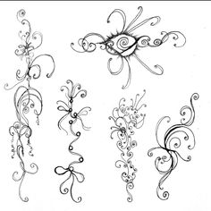 an image of different designs on the back of a tattoo design book page, including swirls and scrolls