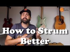 a man holding a ukulele with the words how to strum better