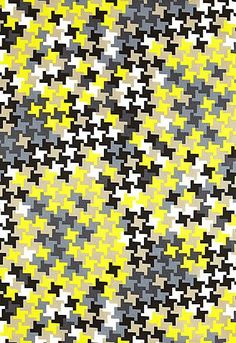 an image of a yellow and black pattern on fabric or paper that looks like it has been made out of squares