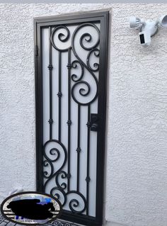 an iron door with a sign that says gibson inn on the side of a building