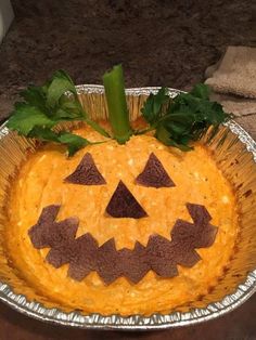 a cake decorated to look like a jack o lantern