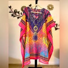 100% Poly. Very Nice Colorful Kaftan With Pyramid Rhinestone Detail On The Front. Vibrant Multicolor Print Beach Blouse, Colorful Beach Blouse With Vibrant Print, Colorful Vibrant Print Beach Blouse, Colorful Vibrant Blouse For Beach, Vibrant Colorful Blouse For Beach, Pink Embellished Bohemian Top, Vibrant Colorful Beach Blouse, Pink Bohemian Embellished Kaftan, Pink Embellished Bohemian Kaftan