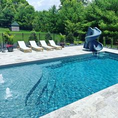 a swimming pool with a slide in the middle