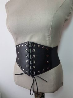 This shop have unique designs by Aylin Taş Gothic punk dark steumpunk cincher lace up corset belt  Materials   White nikel eyelets Black Genuine leather Elastic band  With snaps on the back Please measure your waist as cm or inches for belt order. Any size avaliable.  😉 World wide FREE EXPRESS SHIPPING 30 USD ship cost is required for Africa please inform me . Gothic Belt, Leather Corset Belt, Corset Belt, Leather Corset, Gothic Punk, Suspender Belt, Suspenders, Waist Belt, Elastic Band