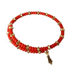 Our Mia Wrap Bracelet with red beads adds a bold pop of color to any outfit. Wear it by itself or stack it with our other beautiful pieces! Product Features: Brass with gold or silver finish Adorned with red beads Nickel-free Adjustable: One size fits most Festive Red Beaded Bangle Bracelet, Festive Red Bangle Beaded Bracelets, Red Hand-strung Bangle Bracelet, Red Bohemian Bracelets With Gold Beads, Red Adjustable Stretch Bangle Bracelet, Red Stretch Bangle Bracelet With Colorful Beads, Layered Coin Necklace, Deco Beads, Red Beads