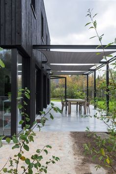 an outdoor dining area with tables and chairs