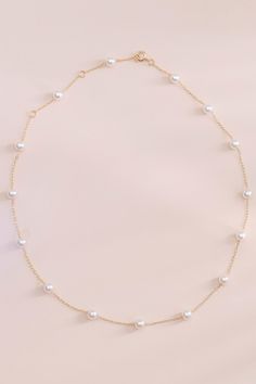 Timeless and trendy collide with our Brighton pearl necklace. It's just perfect for a Regency-inspired wedding or a cottagecore bridal shower. Wear this sweet, understated accessory with a bridesmaid's dress, a holiday sweater, or anything in between. It makes a great gift or a treat for yourself. | Jewelry | Birdy Grey Bowery Pearl Necklace Hoco Necklaces, Briolette Pearl Necklace, Hoco Jewelry, Cottagecore Necklace, Pink Pearl Necklace, Birdy Grey, Casual Necklaces, Pearl Bridal Jewelry, White Pearl Necklace