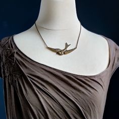 Sparrow In Flight Vintage Style Necklace available in Antiqued Brass o | Ragtrader Vintage Antique Gold Necklace With Oxidized Finish, Vintage Brass Necklace With Oxidized Finish, Antique Brass Necklace With Oxidized Finish, Antique Brass Necklace Nickel Free, Antique Copper Necklace With Antique Finish, Vintage Oxidized Brass Necklaces, Bronze Brass Necklace For Vintage Collection, Antique Brass Nickel-free Necklace, Antique Silver Brass Necklace Vintage Style