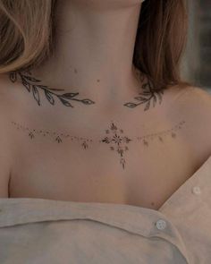 a woman with a tattoo on her chest