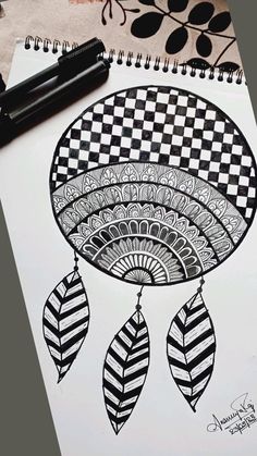 a drawing of a black and white dream catcher