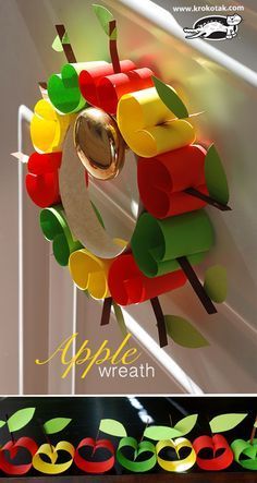 an apple wreath made out of paper with apples on it and the words apple wreath