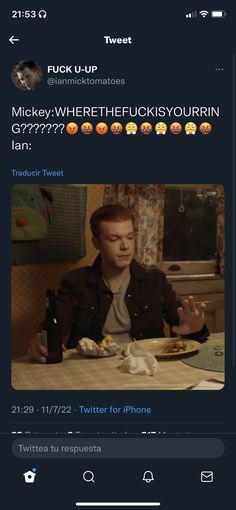 an image of a man sitting at a table with food