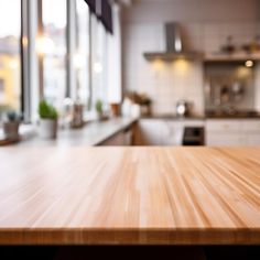 an empty wooden table top in a kitchen