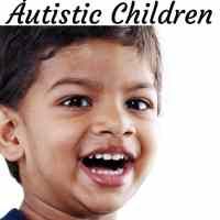 an image of a young boy smiling with the words autisttic children on it