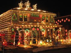 a house covered in christmas lights and decorations