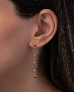 Add a touch of bold elegance to your style with our 14K Gold Paper Clip Chain Stud Earrings. These statement earrings are both elegant and edgy, creating a unique and eye-catching look. The long dangle design adds a touch of drama, making these earrings a must-have for any fashion-forward individual. Sold as a Pair Total Weight: Approx. 1.7 grams Drop Length: Approx. 49mm Standard Production: 3-5 business days Rush Order Production: 2-3 business days Shipping: Select shipping method at checkout. Chain Earing, Gold Paper, Earring Sale, Personalized Necklace, Paper Clip, Ring Bracelet, Art For Sale, Statement Earrings, Ring Earrings