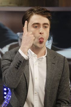 a man making a funny face with his fingers