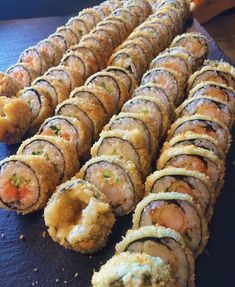 several sushi rolls are arranged on a table