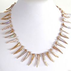 Mother of Pearl Statement Necklace$70.00 Increase your star power with this chic mother of pearl and rock crystal statement piece: https://earthandmoondesign.com/shop/etherea/super-nova-19-inch-mother-of-pearl-statement-necklace/ #GameofThrones inspired- Super Nova, Sideways Initial Necklace, Diamond Bar Necklace, Diamond Choker Necklace, Pearl Statement Necklace, Metalsmithing Jewelry, Dainty Pendant, Cluster Necklace, Diamond Bar