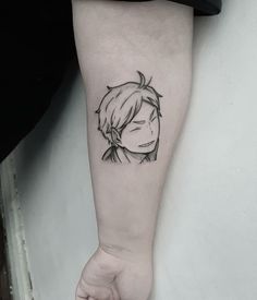 a person with a black and white tattoo on their arm