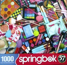 a puzzle box filled with lots of different types of cosmetics and makeup products on top of a table