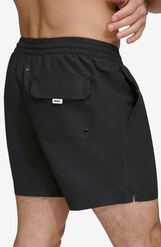 Soak up the sun in these recycled-fiber swim trunks built with UPF 40+ sun protection. 5" inseam (size Medium) Elastic/drawstring waist Front slant pockets; back patch pocket Lined 100% REPREVE polyester REPREVE recycled polyester is made from 100% post-consumer recycled plastic bottles Machine wash, tumble dry Imported Black Casual Swimwear For Outdoor Activities, Casual Black Swimwear For Outdoor Activities, Black Swim Trunks With Pockets For Outdoor Activities, Black Swim Trunks With Pockets For Vacation, Black Beach Shorts For Outdoor, Black Moisture-wicking Swimwear For Outdoor Activities, Moisture-wicking Black Swimwear For Outdoor Activities, Black Swimwear With Functional Drawstring For Summer, Summer Black Swimwear With Functional Drawstring