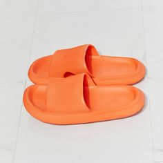 From The Pool To The Supermarket, These Rubber Slides Are All Comfort And All Style. Their Slide-On Design Makes Them Ideal For When You're Running Late, And Their Rubber Composition Makes Them The Perfect Pool Companion. Slide These On With A Matching Lounge Set, Cutoffs And A Tee, Or Biker Shorts And A Crop Cami. - Size: Multiple Available - 6 / 7 / 8 / 9 / 10 - Color: Orange - Width: Standard - Style: Slide Sandal - Open Toe - Rounded Shape - Flat Heel - Slip On - Material: Rubber - Waterproo Comfortable Orange Slides With Round Toe, Comfortable Orange Slip-on Sandals, Comfortable Orange Round Toe Slides, Orange Flat Synthetic Slippers, Comfortable Orange Slide Sandals, Orange Non-slip Flat Sandals, Orange Flat Non-slip Sandals, Non-slip Orange Sandals For Summer, Summer Non-slip Orange Sandals