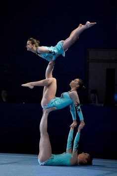 two acrobatic dancers performing on the floor