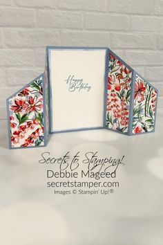 an open card with flowers on it