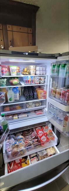 an open refrigerator filled with lots of food