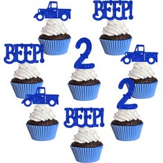 blue cupcakes with white frosting are arranged in the shape of trucks and numbers