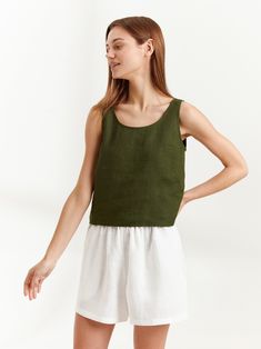 "CALI is a sleeveless tank top with scoop neckline and relaxed fit. DETAILS - Scoop neck - Sleeveless design - Straight cut - Oeko-Tex certified 100% local washed midweight linen - Cut and sewn to order just for you in our studio SIZING & FIT - Fits true to size - Length 18.5\" - Model is 5'8.9\" / 175cm and wearing a size S CARE FOR LINEN - Machine wash up to 30ºC/86ºF gentle cycle - Lay flat to dry or tumble dry low - Warm iron if needed - Do not bleach SIZE GUIDE Size conversion guide Size XS Linen Crop Top, Linen Tank Top, Linen Crops, Linen Tank, Green Tank Top, Green Tank, Summer Blouses, Top Sleeveless, Linen Women