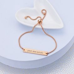 Give any woman of the wedding party this adjustable slide bracelet. We'll custom engrave it with your own words. CUSTOM ENGRAVING: ENGRAVING: [Your Own Words - 25 character max] BACK: [Optional, adds $5, 25 character max] DETAILS: MATERIAL: stainless steel FINISHES: gold, rose gold, stainless steel FIT: adjustable, one size fits most STYLE: slide, fits over hand BRACELET SIZE: up to 9 inches in diameter Slide Bracelet, Gift Inspo, Hand Bracelet, Gold Engraving, Bridesmaid Bracelet, Personalized Anniversary, Text Box, Personalized Bracelets, Engraved Jewelry