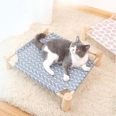 Improve the quality of your cat's naps with our Hammock Cat Bed Wooden Elevated Beds. This bed is designed to provide your cat with a comfortable and elevated sleeping spot, giving them a sense of security and reducing stress. Made with high-quality wood and sturdy materials, this bed is built to last. Give your cat the ultimate lounging experience now. Elevate your cat's relaxation with our Hammock Cat Bed Wooden Elevated Beds. Made from durable, high-quality wood, this elevated bed provides the perfect spot for your feline friend to nap and lounge. With its unique hammock design, your cat will love the comfortable and secure resting spot. Give your cat the gift of comfort and style with our Hammock Cat Bed. Niche Chat, Dog Hammock, Pet Beds Cat, Elevated Bed, Pet Hammock, Hammock Bed, Cat Window, Dog Bed Furniture, Cat Hammock