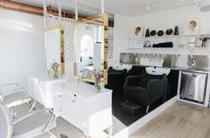 a living room filled with furniture and white walls