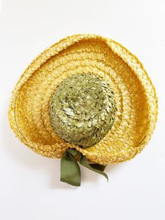 Lovely midcentury summer hat - Wide, upturned yellow straw brim - Tall green straw crown wrapped with matching green grosgrain ribbon - Bow at back - Grosgrain ribbon band inside - Label: Reproduction of Paulette Retro Green Hat For Vacation, Green Fedora Straw Hat For Kentucky Derby, Green Brimmed Straw Hat For Garden Party, Green Wide Brim Straw Hat For Garden Party, Green Straw Hat With Curved Brim For Garden Party, Green Curved Brim Straw Hat For Garden Party, Vintage Yellow Sun Hat With Curved Brim, Vintage Green Summer Hat, Green Vintage Adjustable Sun Hat