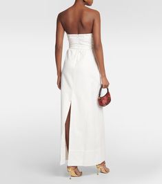 Matelassé cutout strapless maxi dress in white - Adriana Degreas | Mytheresa Chic Bandeau Maxi Dress For Day Out, Chic Bandeau Maxi Dress, Elegant Strapless Maxi Dress For Day Out, Bandeau Dresses For Daywear, Chic Cotton Maxi Dress For Daywear, Cotton Strapless Dress For Daywear, Elegant Cotton Dresses With Side Slits, Strapless Dresses With Side Slits For Spring, Strapless Midi Dress With Side Slits