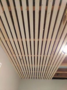 the ceiling is made out of wooden slats